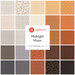 A collection of 24 fabric fat quarters with various patterns in orange, black, and white tones.