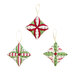 The three completed ornaments colored in red, white, and light green Christmas fabrics, isolated on a white background.