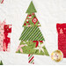 A close up on one of the Christmas tree blocks, demonstrating fabric, piecing, and topquilting details.