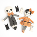 The completed dolls made from the panel, isolated on a white background.
