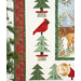 A decorative quilt featuring red cardinals, pine trees, and a nature scene with deer.