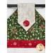 A close up of a decorative towel featuring pinecone and leaf patterns in green, with red snowflake fabric and button.