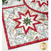 Quilted hot pad featuring a star design with fabrics featuring woodland animals, greenery, and red accents.