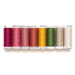 Eight spools of thread that coordinate with the Little Garden House in Christmas kit, arranged in rainbow order, isolated on a white background 