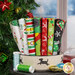 Collection of Fat Quarter fabrics inside of a dog bowl in front of a festive Christmas setting.