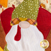 A super close up on the applique turkey gnome, demonstrating fabric and topstitching details.