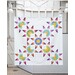 A completed sample quilt of one of the featured projects in the pattern book, a starry design.