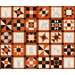 A quilt comprised of various quilt blocks in orange, black, and cream, featuring intricate patterns and images.