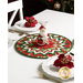 A shot of the table topper on a white table set with matching white plates holding red poinsettias. An adorable smiling Santa decoration sits at the center of the topper.