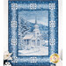 A quilt featuring a snowy church scene framed by blue and white patterns, set in a winter landscape.