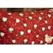 A super close up on the Santa fabric of the pillowcase, showing details on the gnomes.