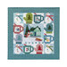 The completed Frost Hill wall hanging, featuring snowman, mitten, and cocoa mug blocks bordered in teal geometric fabric, isolated on a white background.