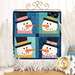 The completed Foundation Paper Piecing Series 2 project for January, an arrangement of four festive snowmen in aqua, navy, and white fabrics, staged on a rustic wooden tabletop from a craft stand with coordinating decor.