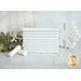 A stack of white fabrics included in the Essentials Stocking Stuffers 2 collection with snowflakes and trees and mistletoe and thread.