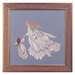 The completed Angel of Mercy cross stitch hung in an ornate wooden frame.