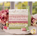 A stack of the fabrics included in the Shades of Romance collection, with flowers and a bottle and thread.