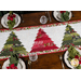 A top down shot of the runner, showing the three main pieced trees with the white tree silhouettes, staged with coordinating plates and napkins.