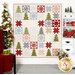 The completed Twinkle quilt, colored in cream, red, green, blue, and gray fabrics from the On Dasher collection by Moda Fabrics. Hung on a white paneled wall, it is staged with coordinating Christmas decor.