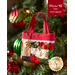 A small red patchwork tiny tote bag hangs on a Christmas tree, decorated with ornaments and a tag. A red banner at the top reads 