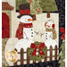 A super close up on two applique snowmen, demonstrating fabric, applique, top stitching, and embroidery floss details.