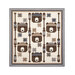 The completed Cozy Paddling Bears Quilt in soft cream, brown, and blue fabrics, isolated on a white background.