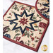 Patchwork quilted hot pad featuring a star pattern in cream, red, and blue