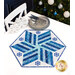 A blue and white star shaped table topper adorned with snowflakes with silver cutlery and snowflake decor.