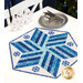 A blue and white star shaped table topper adorned with snowflakes with silver cutlery and snowflake decor.