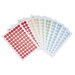 Sheets of colorful round labels featuring letters and numbers in various colors.