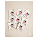 8 loose premium woven sew-in labels spread out on a white background.