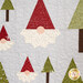 A close up on one of the larger gnomes and trees, demonstrating the dresden plate style of the beards and showing fabric, laser shape, and topquilting details.