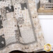 A patchwork quilt with neutral tones and nature-inspired patterns surrounded by decor.