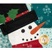 Close-up of a quilted snowman with a black hat and holly, featuring a carrot nose and button eyes.