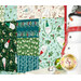 A colorful patchwork quilt featuring festive patterns and a snowman figurine in the foreground.