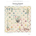 Front of the Sewing Basket pattern featuring the completed quilt, isolated on a white background.