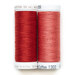 Two spools of thread in red and pink isolated on a white background.