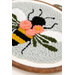 A super close up on the Bloomin Bee project, showing fine details on the yarn bee and flowers.