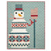 A patchwork quilt featuring a whimsical snowman with a top hat, scarf, and holding a broom.