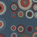 Abstract pattern featuring circular motifs in varied colors on a dark blue fabric.