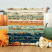 A photo of a stack of fabrics in autumn colors and patterns, featuring pumpkins and floral designs.