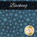 A swatch of dark teal blue fabric with tonal aqua snowflakes. A dark blue banner at the top reads 