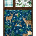 A super close up on the patchwork of the quilt, showing details on a dark blue fabric with snowflakes and woodland animals.