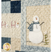 A super close up of the snowman and ho ho ho blocks, demonstrating fabric, applique shape, embroidery, piecing, embellishment, and stitching details.