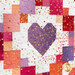 A close up on a wisteria purple patchwork heart block, showing piecing, layout, fabric, and top quilting details as the gold metallic heart accents leap off the colorful fabrics. 