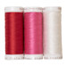 Three spools of thread in red, pink, and white arranged side by side on a white background.