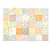 A patchwork changing mat made of various colorful squares in pastel shades isolated on a white background