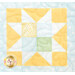 Colorful quilt block featuring a geometric pattern in yellow, green, and white on a light blue background.