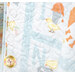 Colorful quilted fabric featuring baby chicks birds and whimsical patterns.