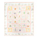 A colorful children's quilt featuring alphabet and themed squares isolated on a white background.