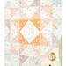 Colorful quilt featuring a patchwork of orange, lavender, and white triangles with playful polka dots.